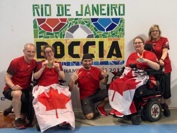 Kristyn Collins and Alison Levine celebrate with their performance partners and Head Coach César Nicolai at the Rio de Janeiro 2022 World Boccia Cup
