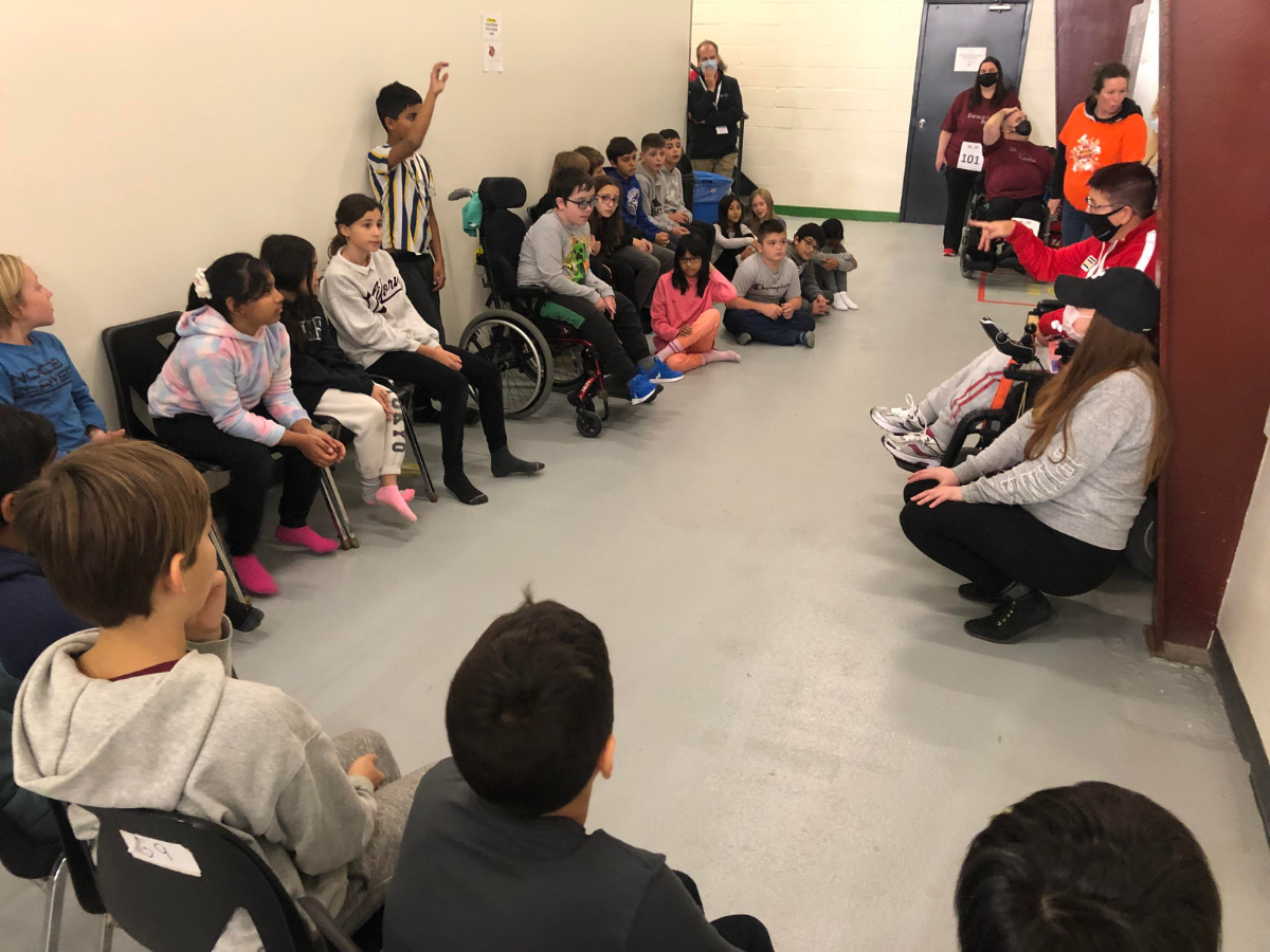 Students from St. Kateri Elementary School asking Tammy McLeod questions